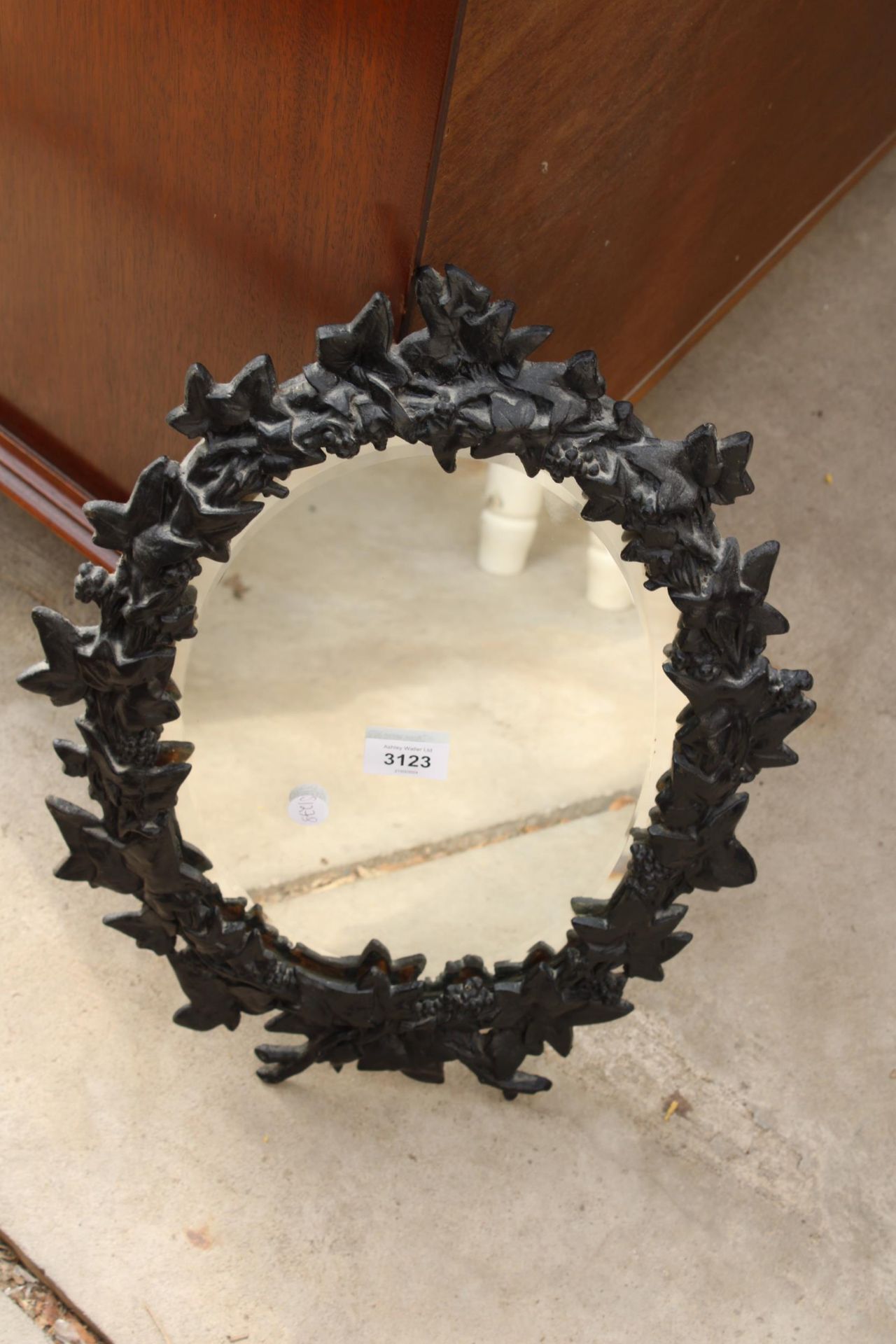 A VICTORIAN STYLE CAST IRON WALL MIRROR WITH VINE LEAF DECORATION, 19" X 14" - Image 2 of 2
