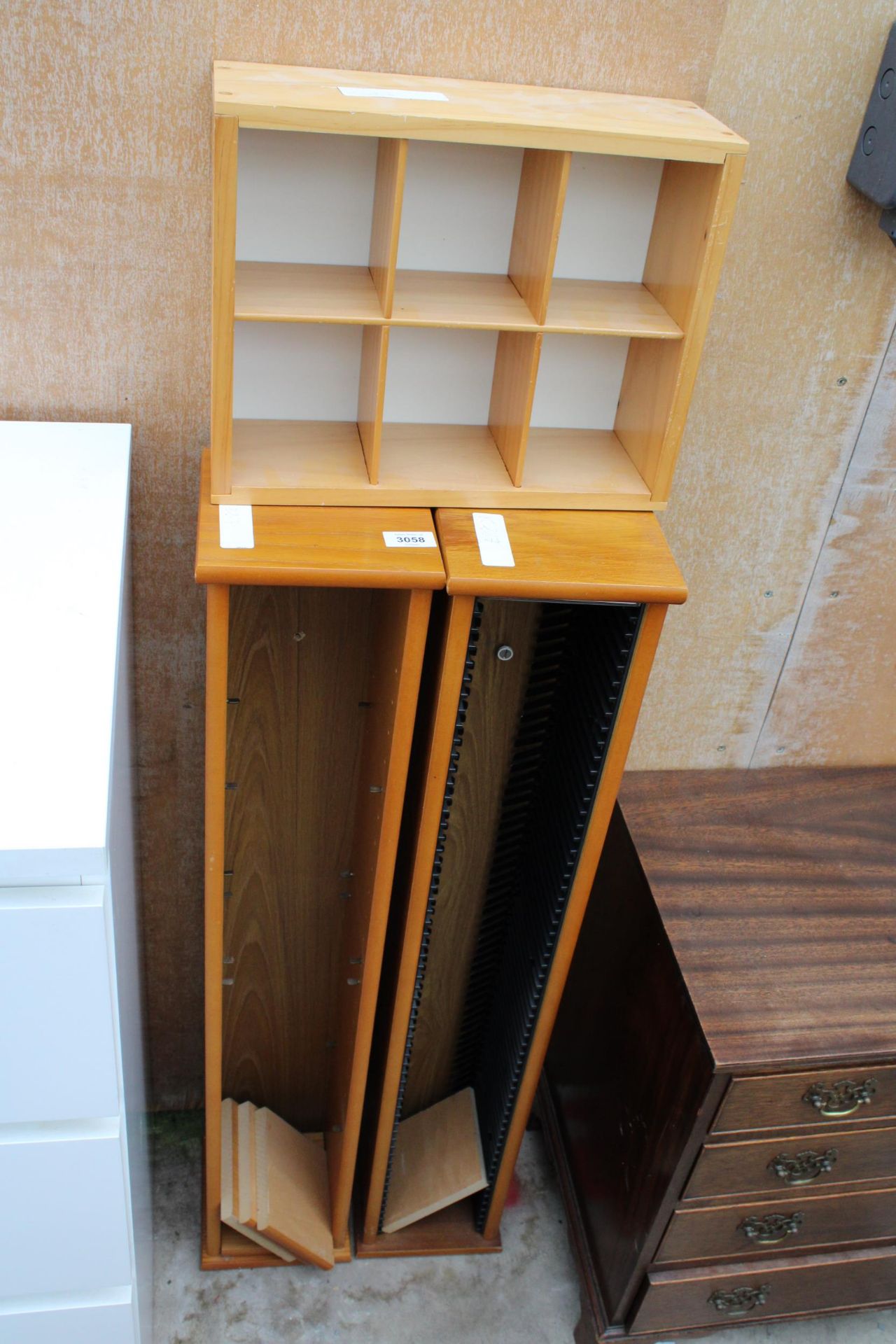 TWO CD RACKS AND A SMALL OPEN SHELVING UNIT