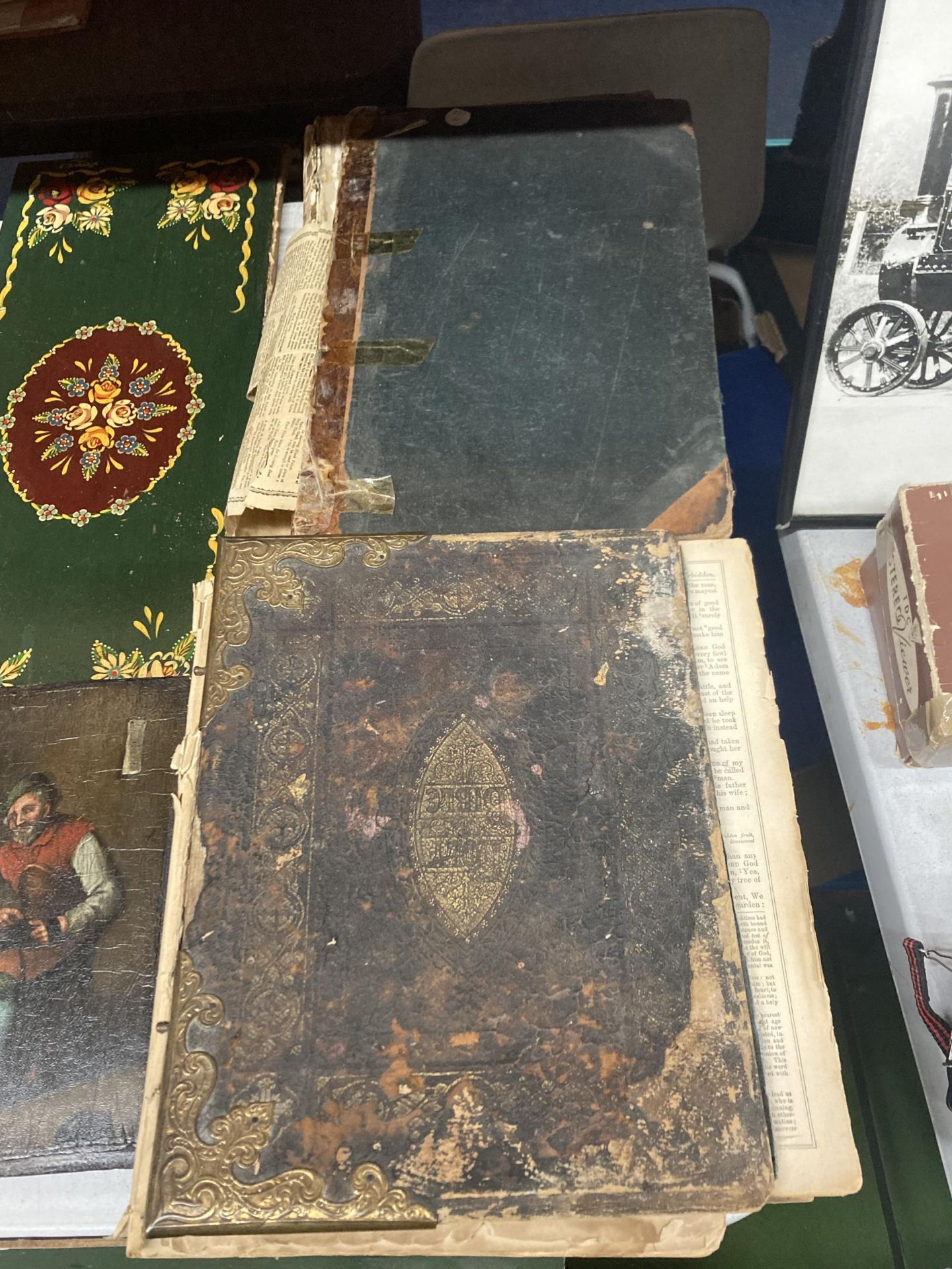 TWO EARLY HARDBACK HOLY BIBLES TO INCLUDE THE OLD AND NEW TESTHMENTS, THE SACRED TEXT OF THE OLD
