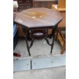 AN OCTAGONAL LATE VICTORIAN CENTRE TABLE WITH GALLERIED UNDER TIER 27" ACROSS