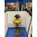 AN ART NOUVEAU COPPER AND PAINTED GLASS OIL LAMP