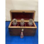 A VINTAGE LINED WOODEN CHEST WITH THREE CRANBERRY GLASS BOTTLES COMPLETE WITH KEY