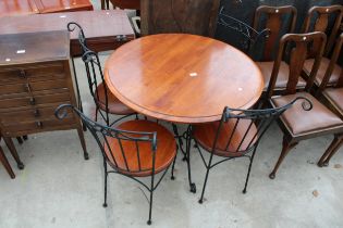 A HARDWOOD DINING TABLE ON A METALWARE BASE 36" DIAMETER AND FOUR MATCHING CHAIRS