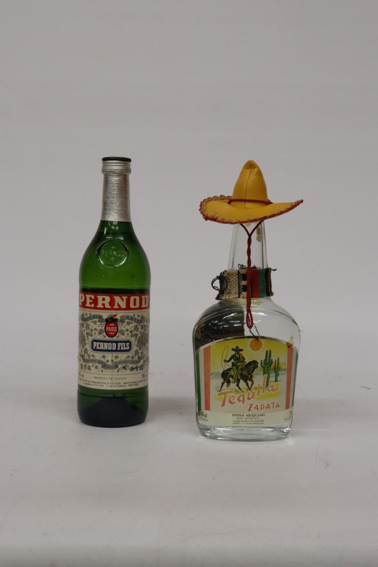 A 70CL BOTTLE OF ZAPATA TEQUILA AND A 70CL BOTTLE OF PERNOD FILS