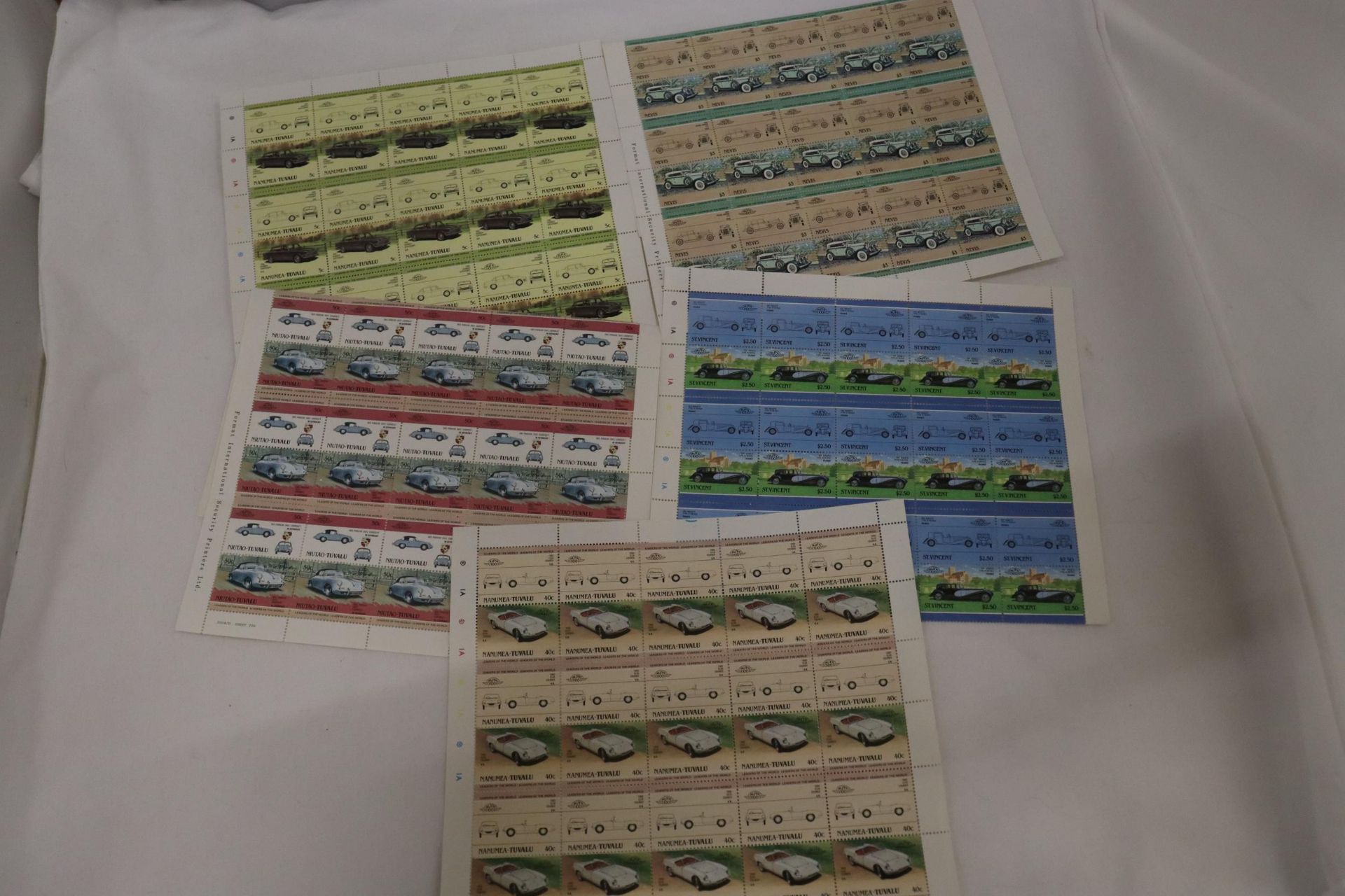 A COLLECTION OF FULL SHEETS OF CLASSIC CAR STAMPS