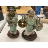 TWO ORIENTAL CERAMIC FIGURES ON WOODEN STANDS, HEIGHTS 23CM