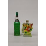 TWO BOTTLES OF LIQUOR TO INCLUDE A MAP OF SPAIN BANANA LIQUEUR AND SUNTORY MIDORI MELON LIQUEUR