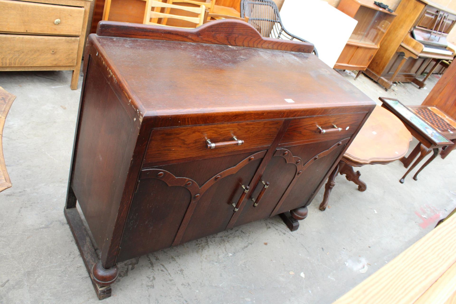 AN OAK ART DECO SIDEBOARD