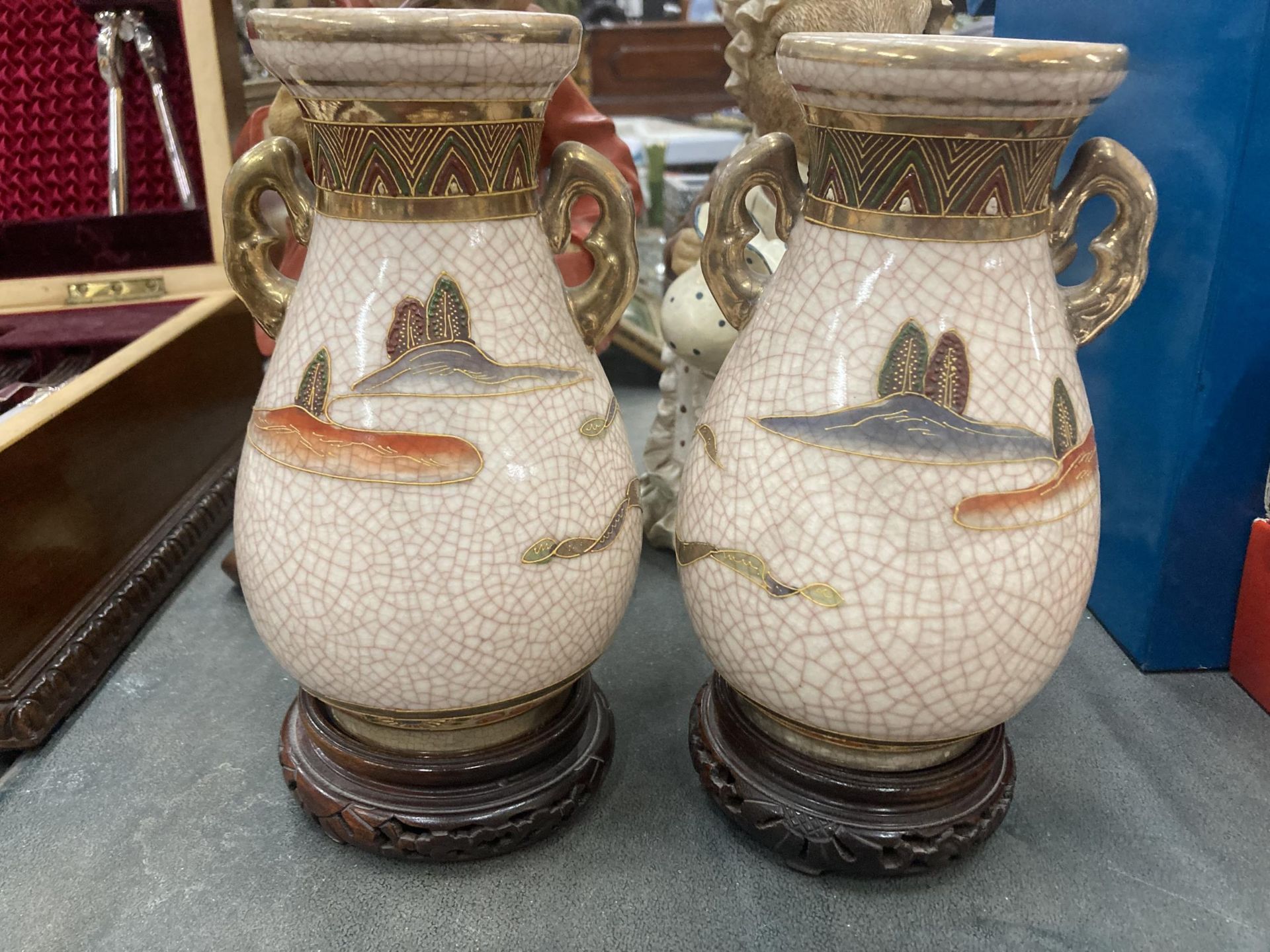 A PAIR OF TWIN HANDLED SATSUMA VASES ON WOODEN STANDS - Image 2 of 3