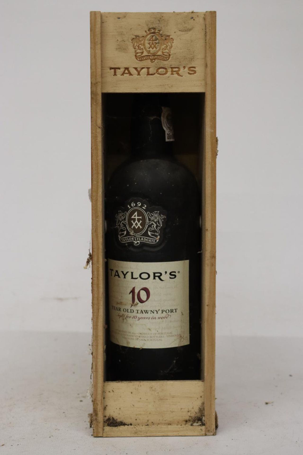 A BOTTLE OF TAYLOR'S 10 YEAR TAWNEY PORT IN WOODEN PRESENTATION BOX