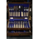 A VINTAGE CANTEEN OF CUTLERY IN A MAHOGANY CASE WITH BOTTOM DRAWER