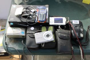 AN ASSORTMENT OF CAMERAS AND A NOKIA MOBILE PHONE