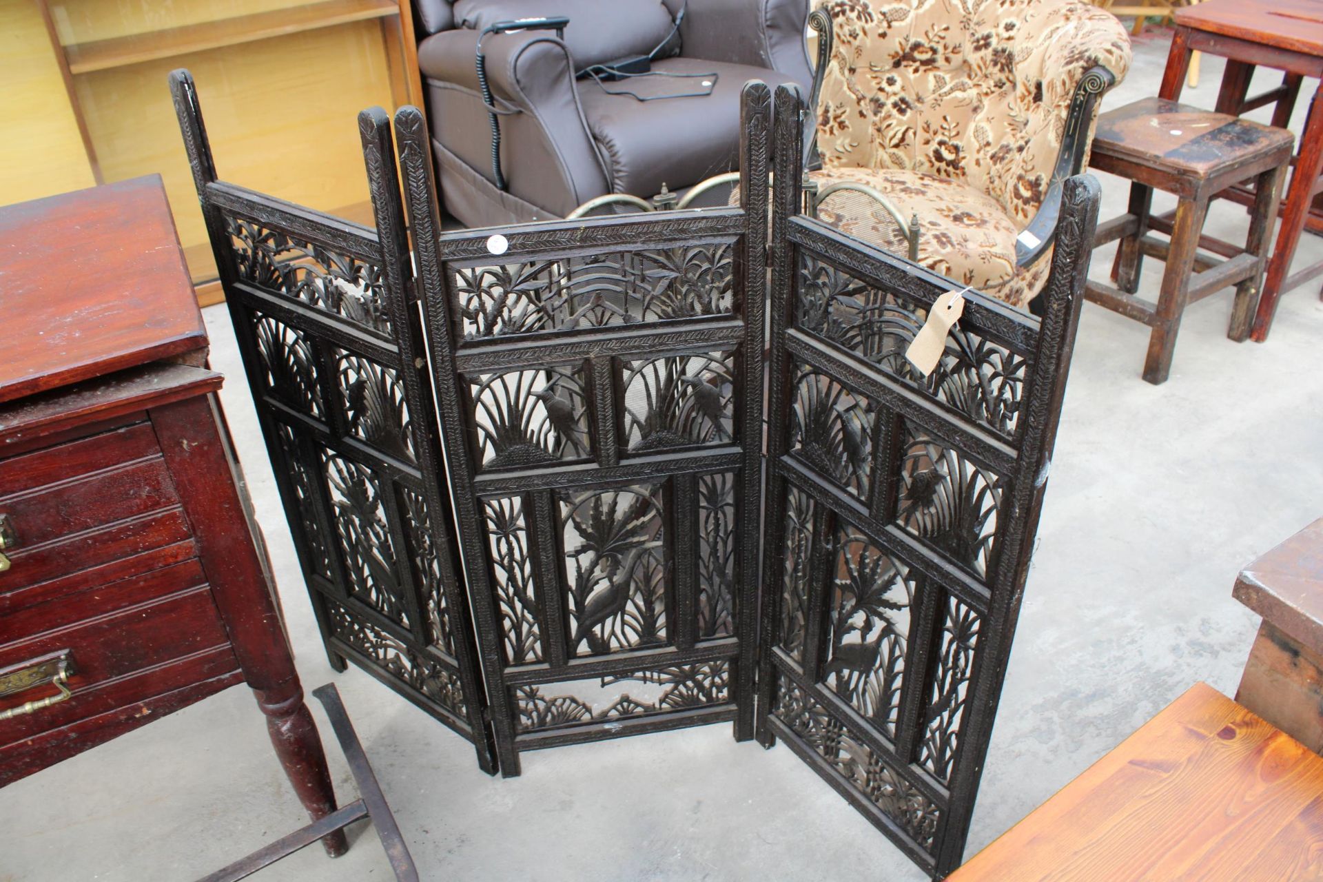 AN EBONISED THREE DIVISION PIRECED SCREEN AND CARPET BEATER - Image 2 of 2