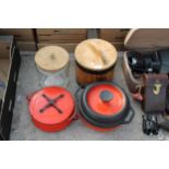 TWO VINTAGE CAST IRON PANS, A WOODEN BARREL AND A GLASS BARREL ALL WITH LIDS