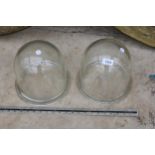 A PAIR OF VINTAGE GLASS DISPLAY DOMES BEARING THE MARK FLP TYPEA