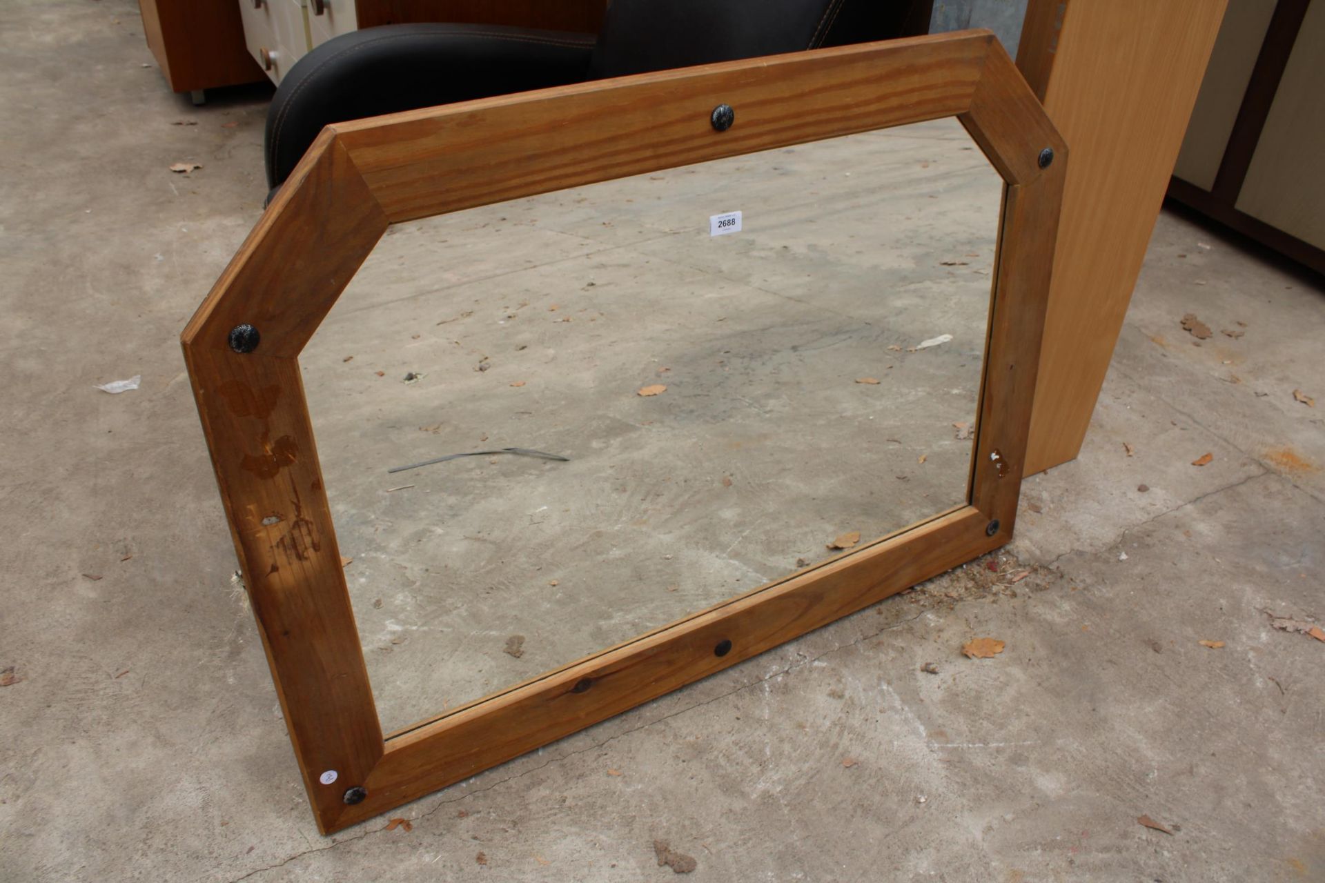 A MEXICAN PINE FRAMED MIRROR 42" X 31"