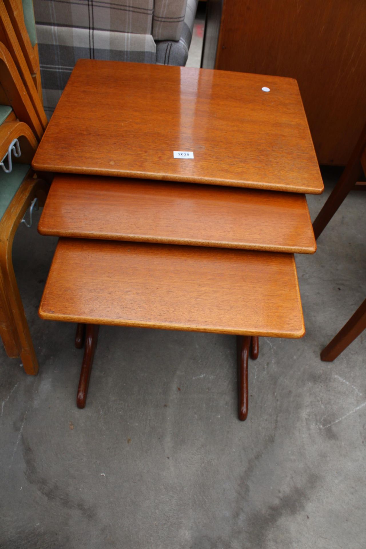 A RETRO TEAK NEST OF THREE TABLES - Image 2 of 2