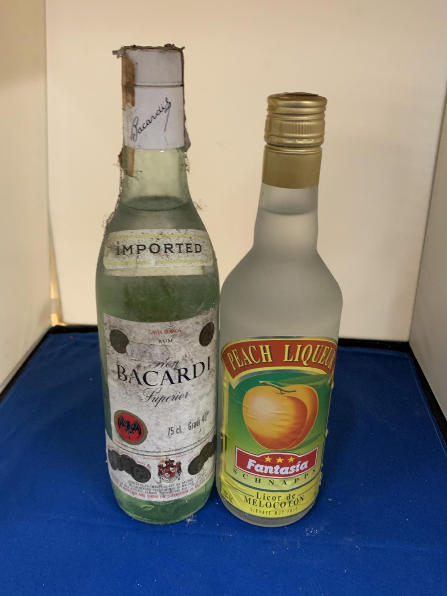 TWO BOTTLES TO INLCUDE A BACARDI SUPERIOR AND A PEACH LIQUEUR