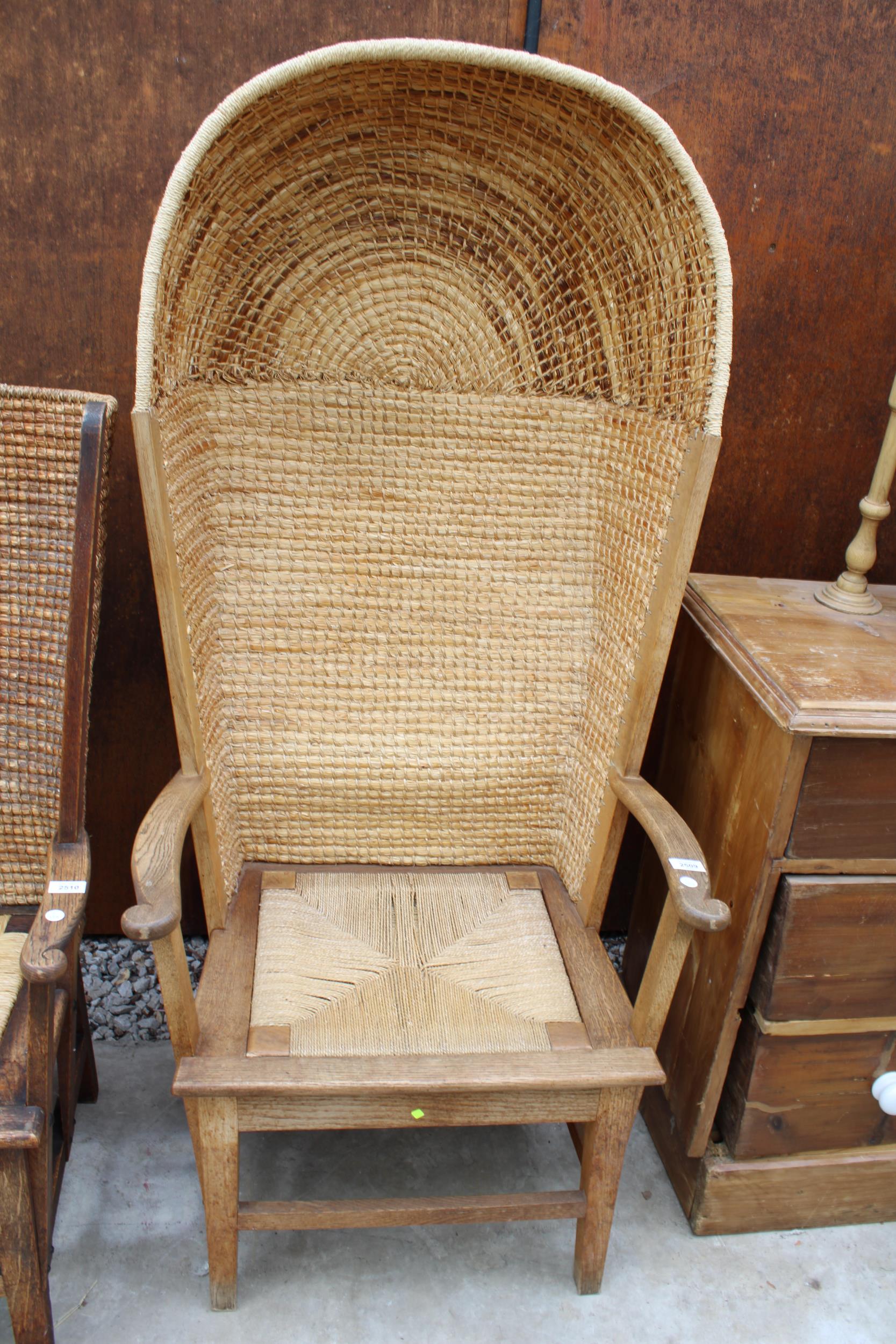 A HOODED OAK FRAMED ORKNEY CHAIR WITH WICKER SEAT AND STITCHED STRAW BACK, STAMPED D M KIRKNESS,