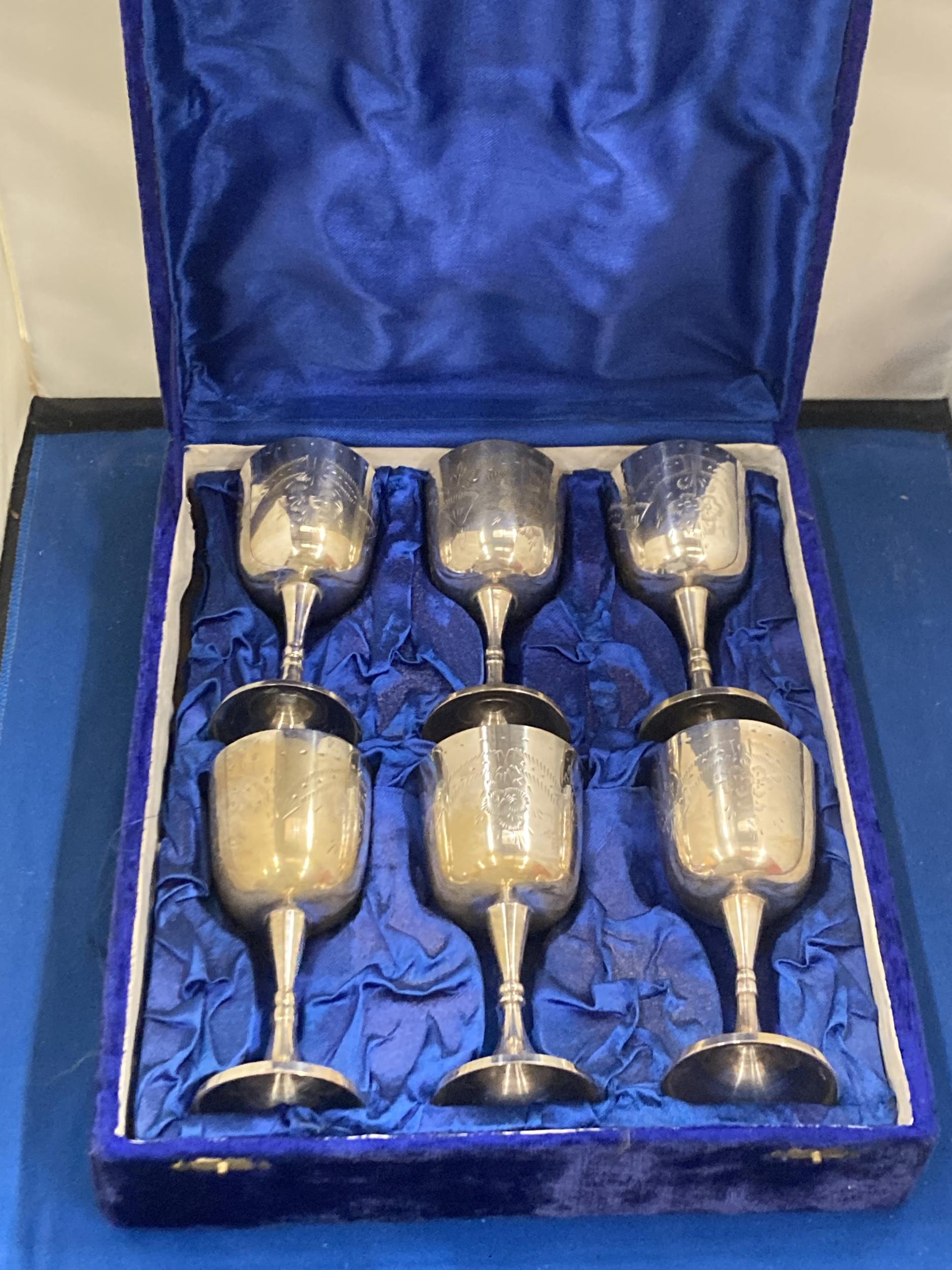 A SET OF SIX SILVER PLATED GOBLETS IN A PRESENTATION BOX