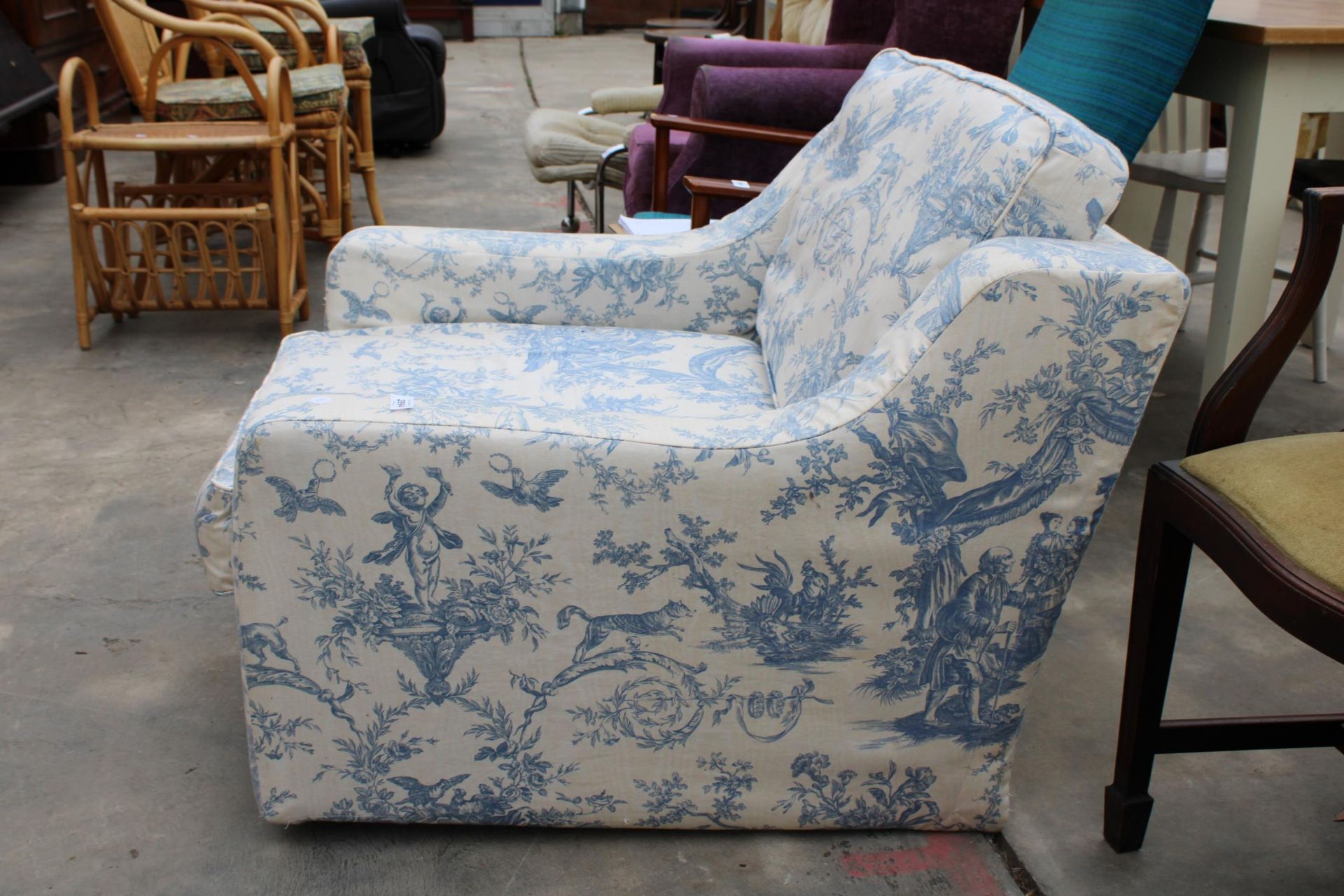 A LOW EASY CHAIR WITH FLORAL COVER - Bild 2 aus 3