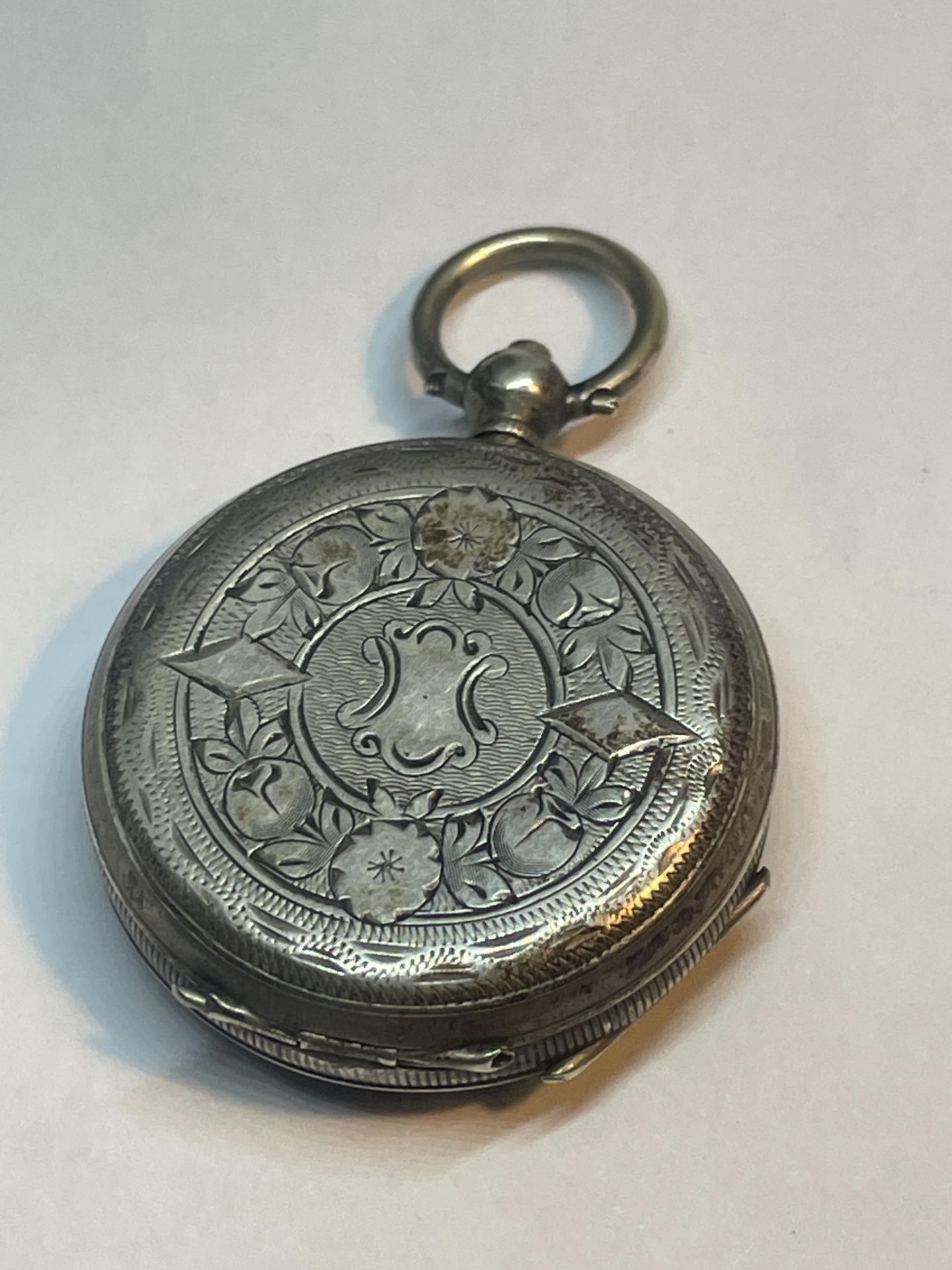 A MARKED 800 SILVER POCKET WATCH WITH WHITE ENAMEL DECORATIVE FACE AND ROMAN NUMERALS - Image 2 of 3