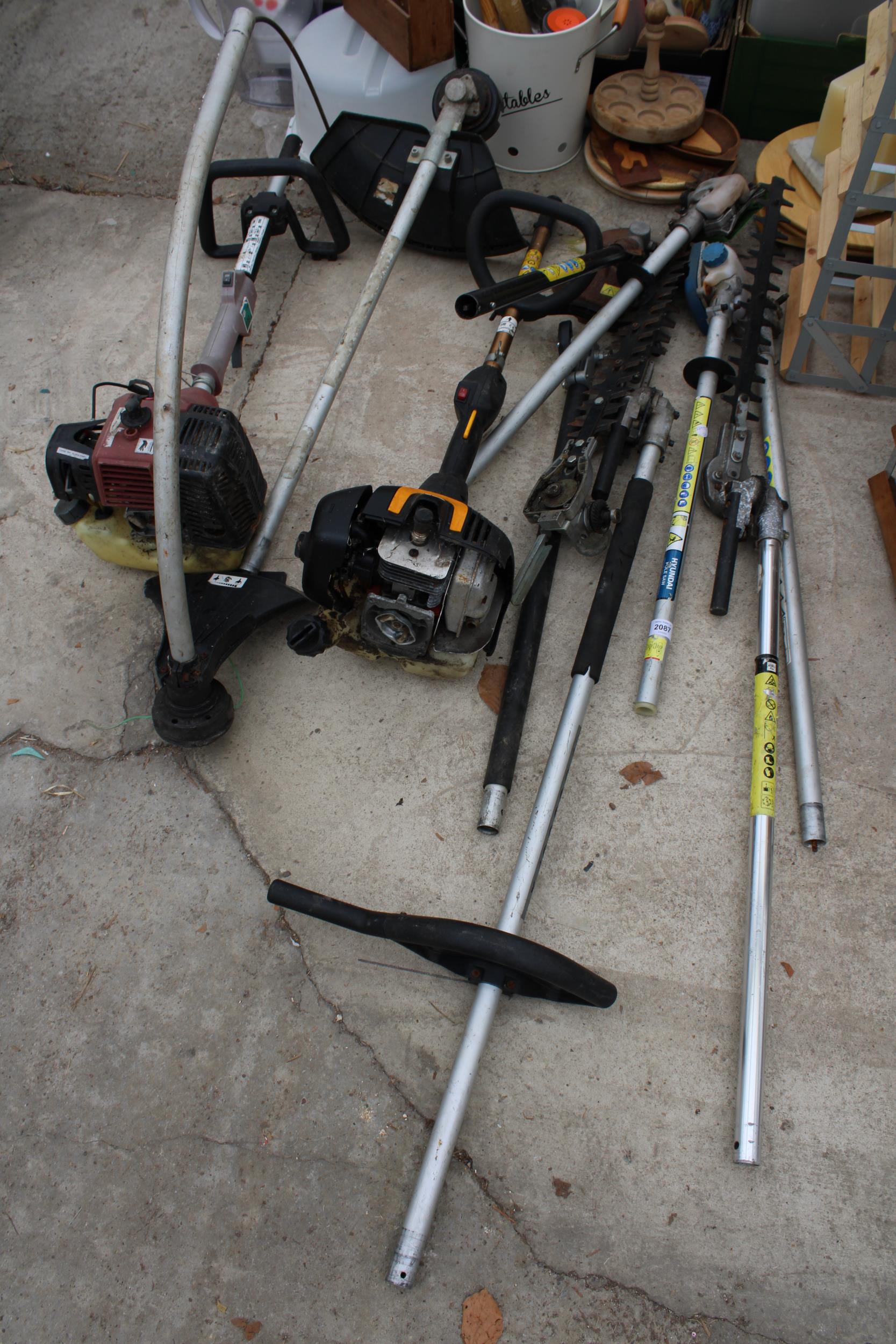 TWO PETROL STRIMMER BODIES AND AN ASSORTMENT OF LONG REACH HEDGE TRIMMER ATTATCHMENTS AND STRIMMER