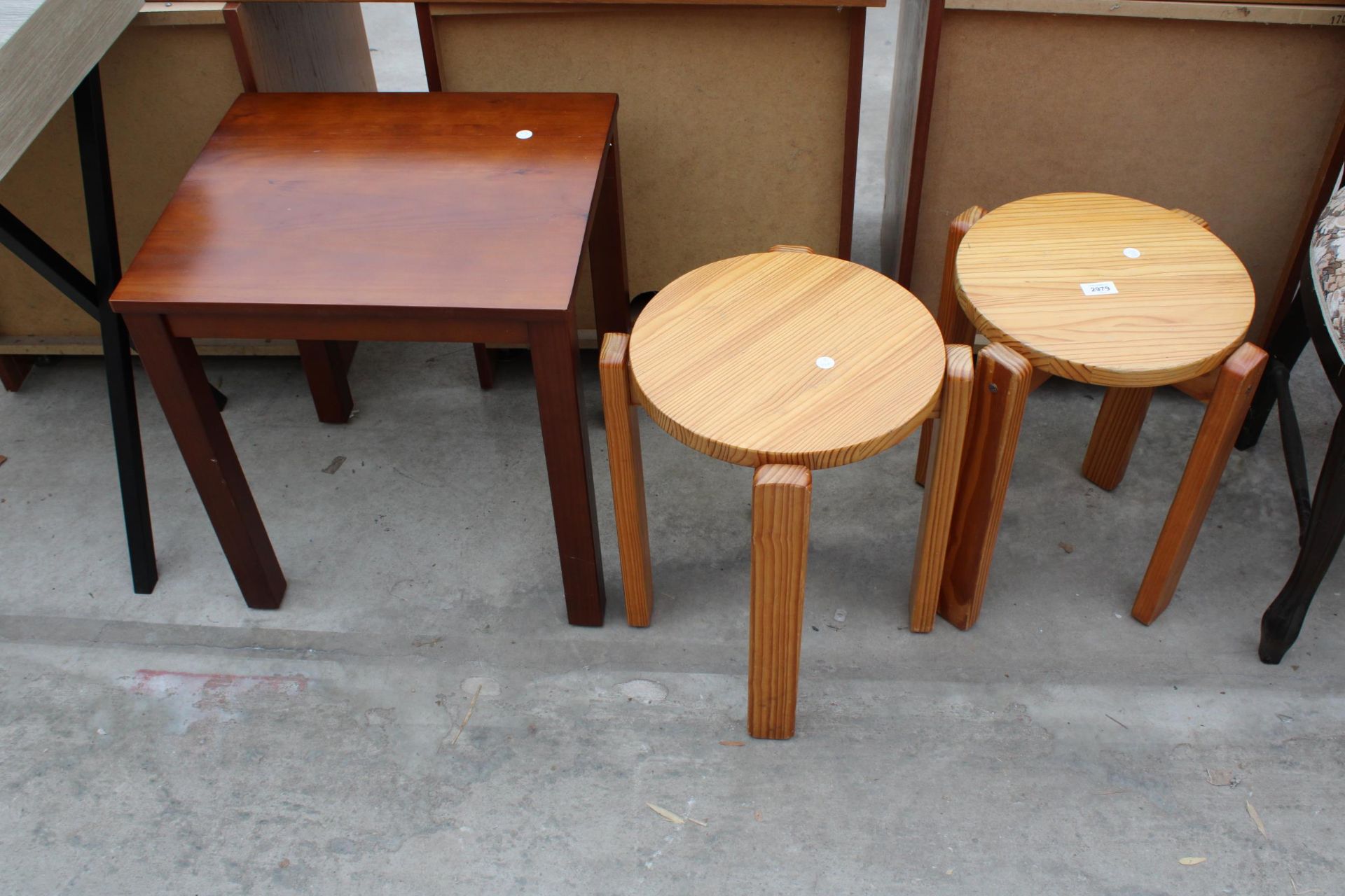 A PAIR OF PINE STACKING STOOLS AND A LAMP TABLE