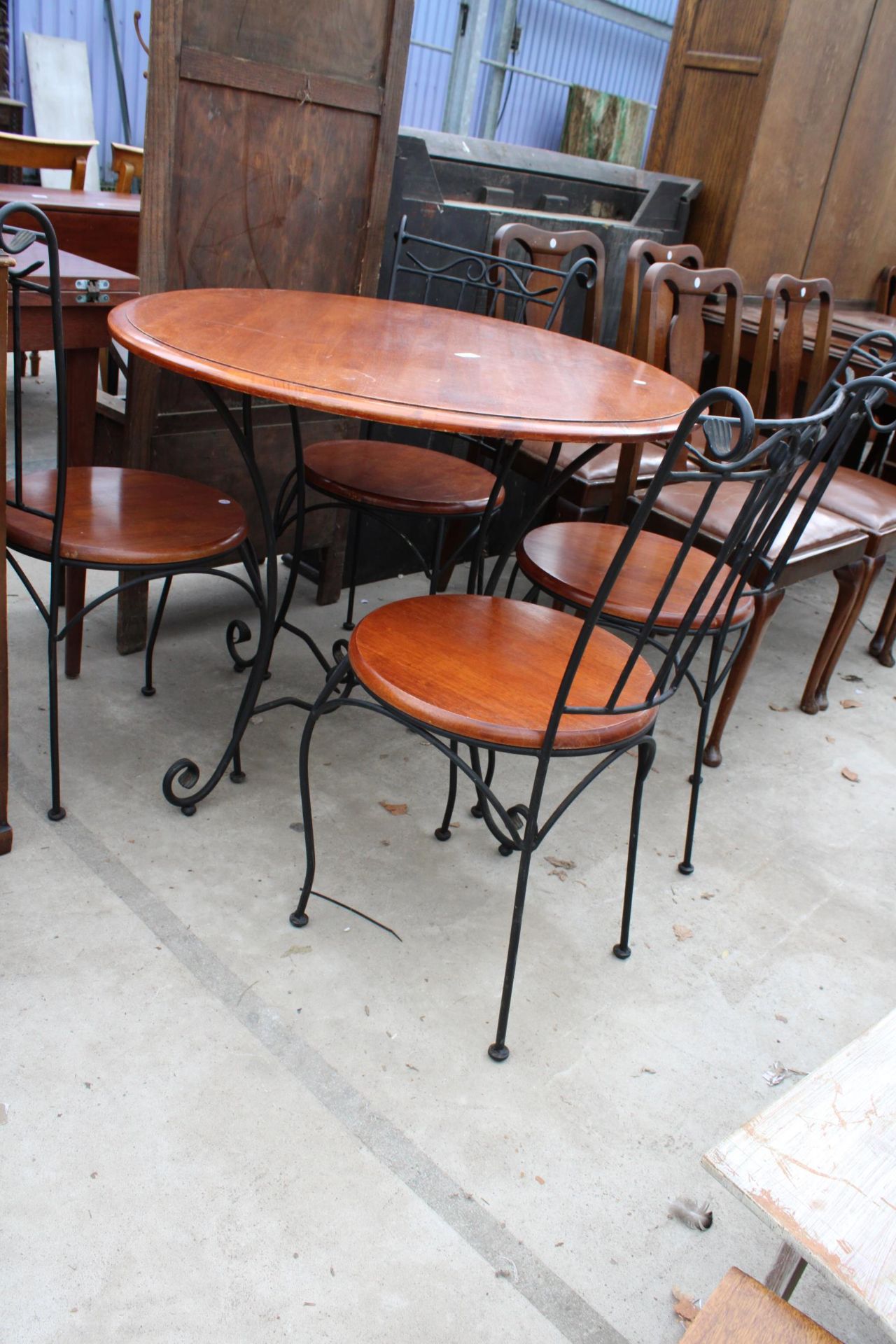 A HARDWOOD DINING TABLE ON A METALWARE BASE 36" DIAMETER AND FOUR MATCHING CHAIRS - Image 2 of 4