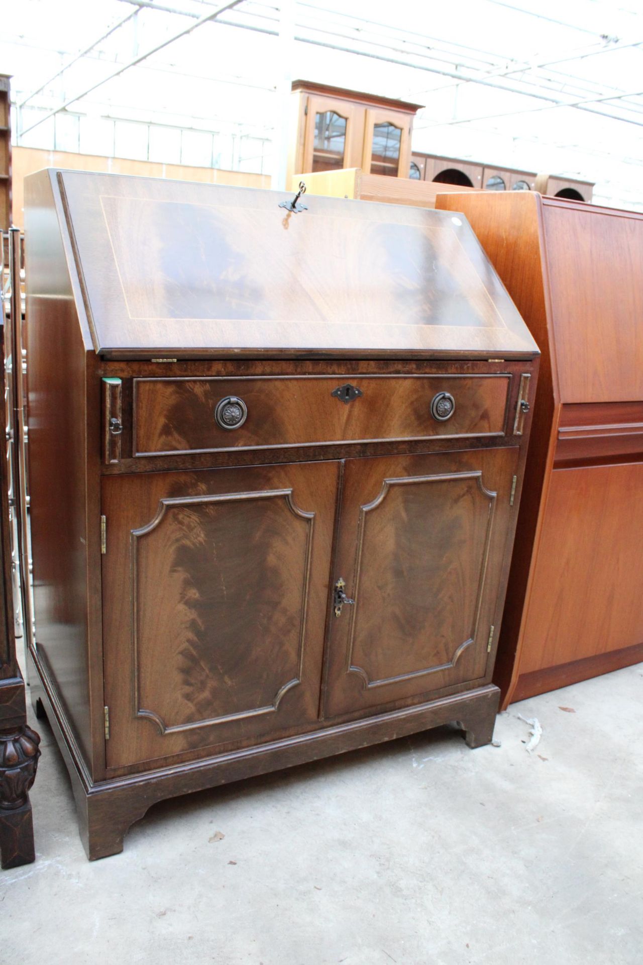 A REPRODUCTION MAHOGANY AND CROSSBANDED BUREAU WITH FITTED INTERIOR 29" WIDE - Image 2 of 3