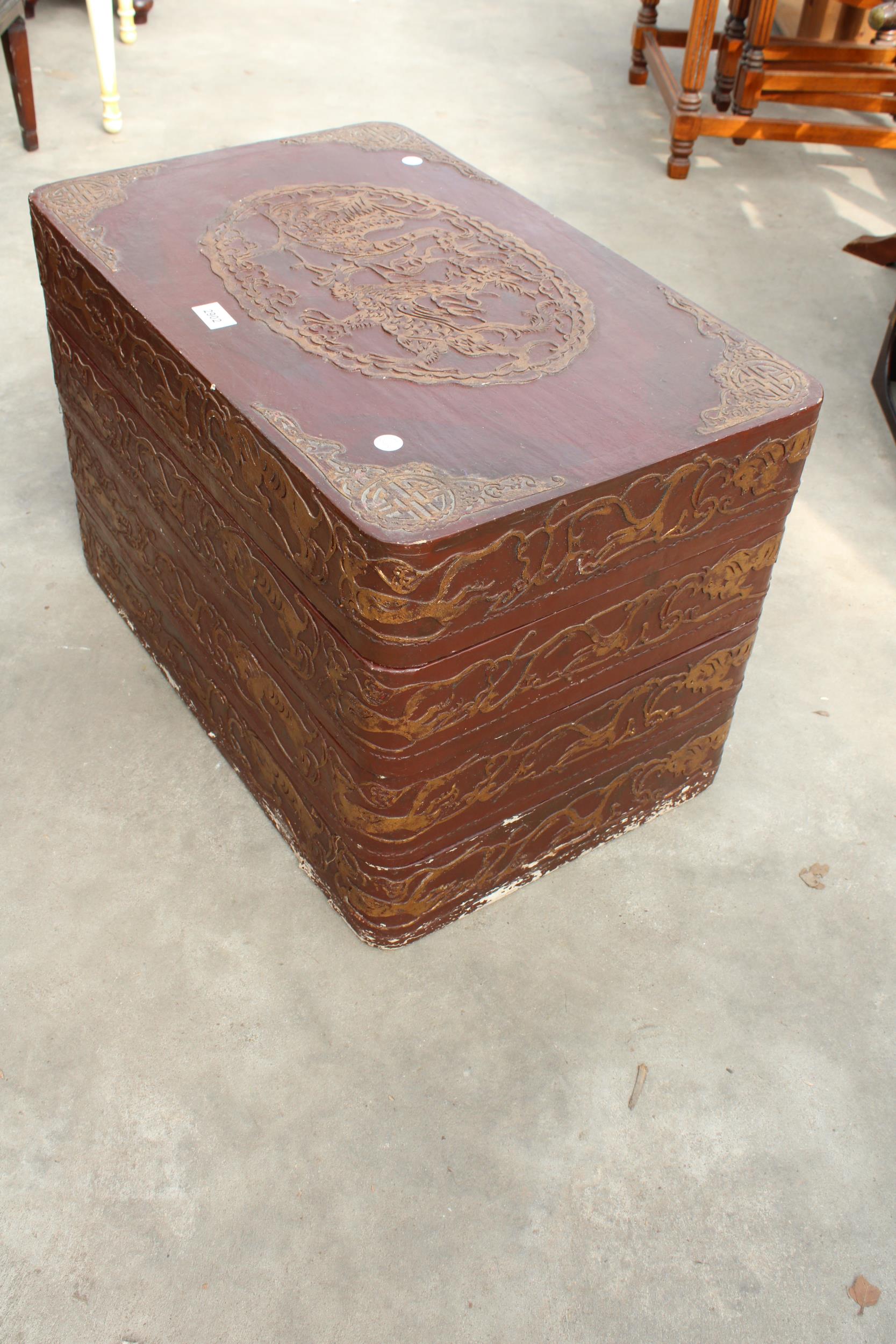 AN ORIENTAL FOUR DIVISION STACKING STORAGE BOXES WITH RAISED GILT DECORATION 24" X 15" AND 16" HIGH