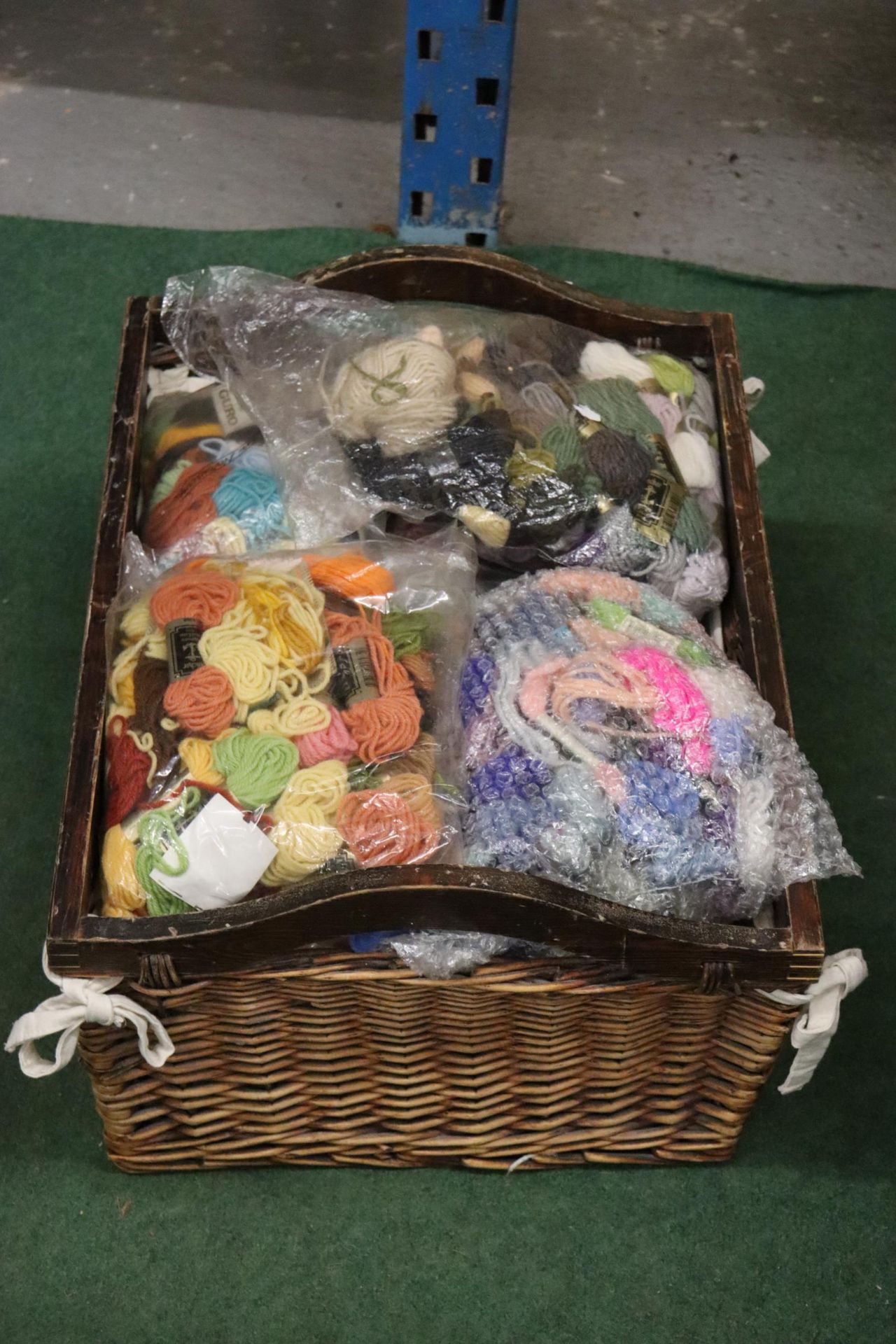 A LARGE BASKET OF TAPESTRY WOOL