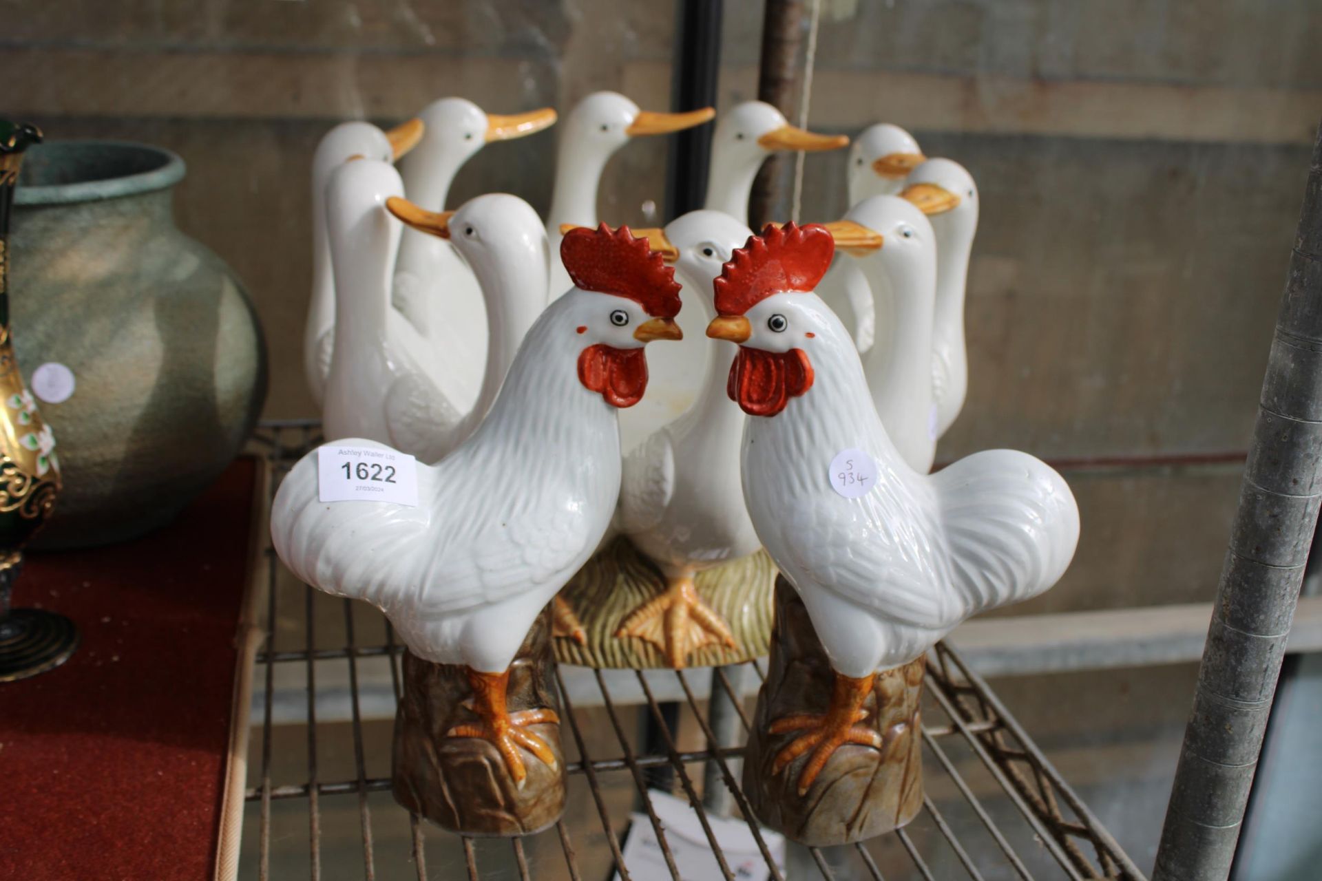 A LARGE CERAMIC DUCK BOWL AND TWO CERAMIC CHICKENS
