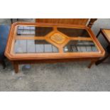 A MODERN OAK AND HARDWOOD COFFEE TABLE WITH INSET GLASS AND CARVED TOP, 52" X 28"