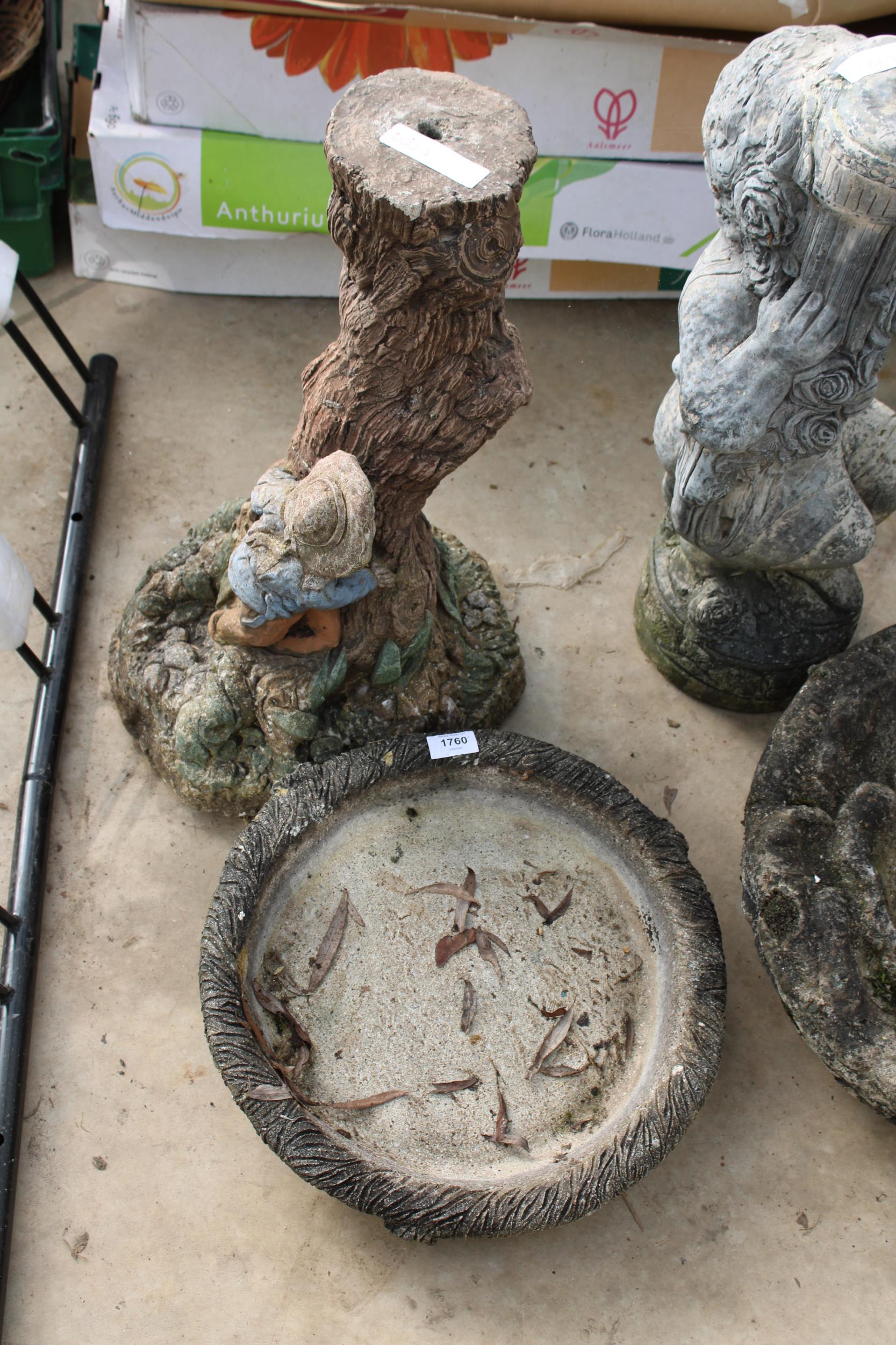 A CONCRETE GARDEN BIRDBATH WITH PEDESTAL BASE