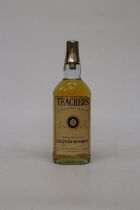 A 26 1/2 FL OZS BOTTLE OF TEACHERS HIGHLAND CREAM SCOTCH WHISKY