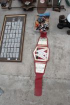 AN ASSORTMENT OF WRESTLING FIGURES AND A BELT