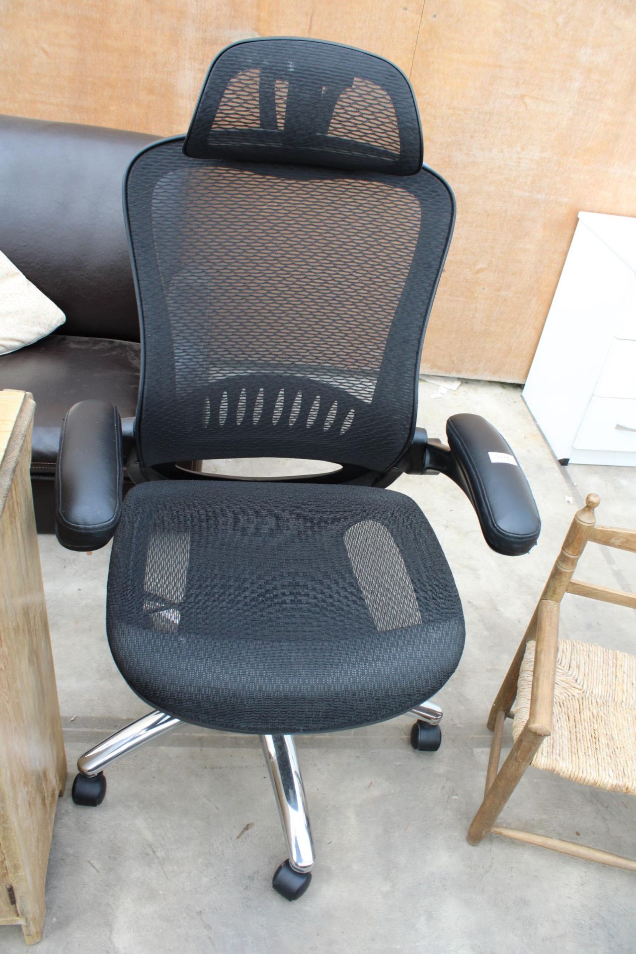 A REVOLVING RECLINING GAMING CHAIR