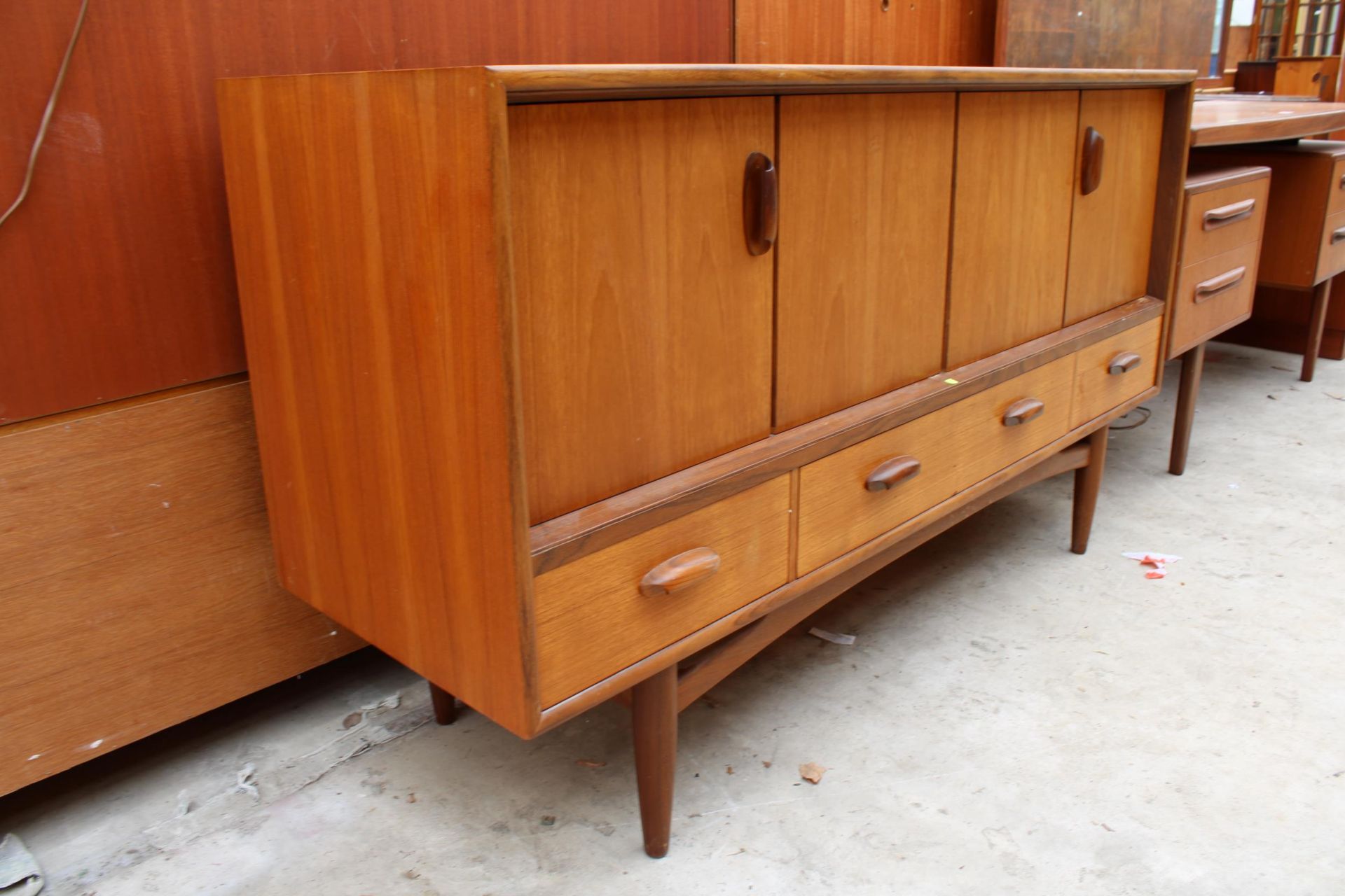 A G PLAN RETRO TEAK SIDEBOARD ENCLOSING TWO BI FOLD DOORS AND THREE DRAWERS 57" WIDE - Bild 2 aus 3