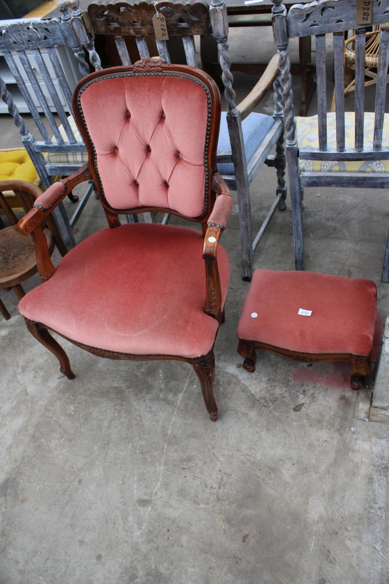 A CONTINENTAL STYLE OPEN ARMCHAIR AND STOOL