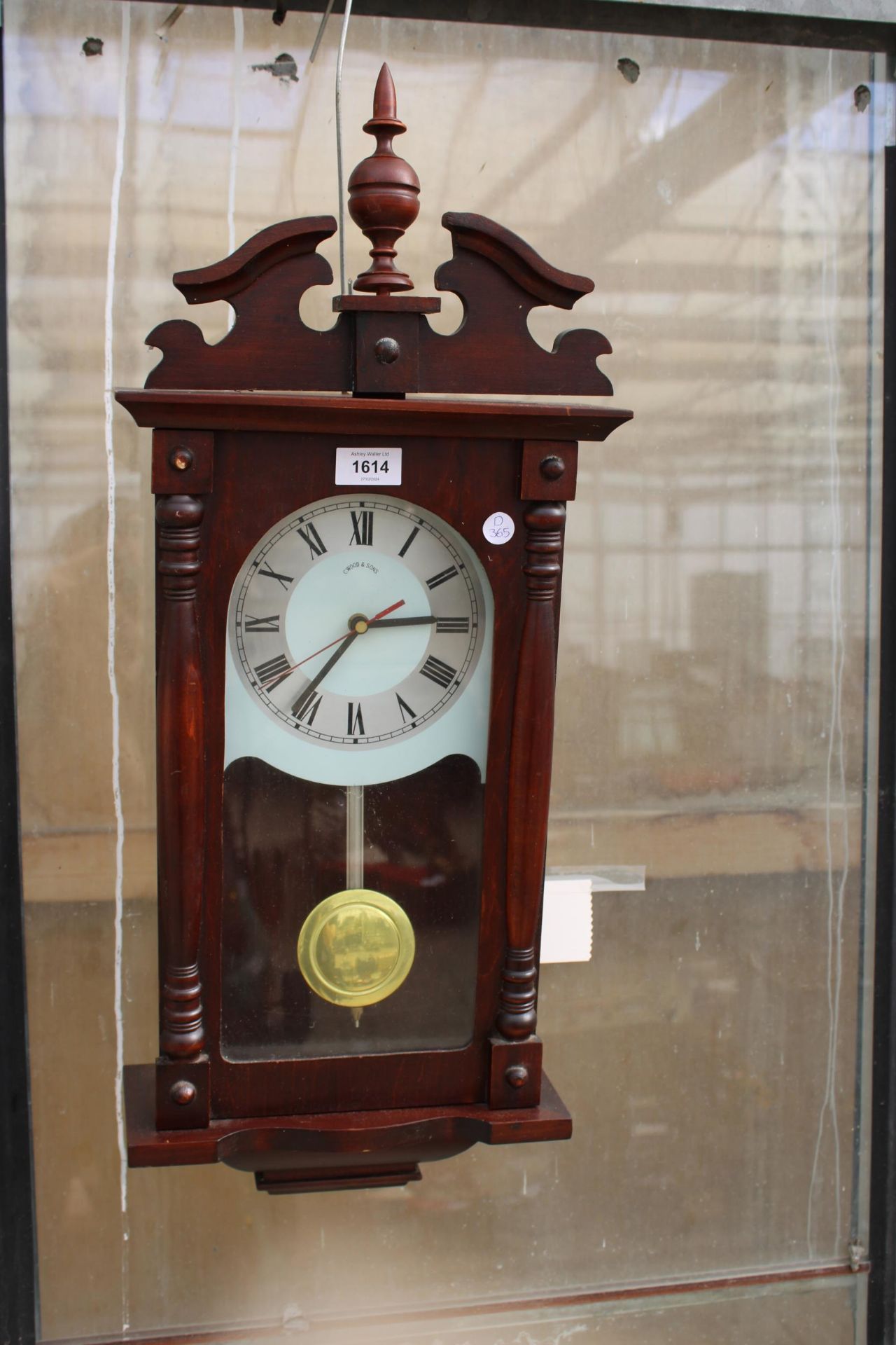 A WOODEN CASED C.WOOD &SONS WALL CLOCK