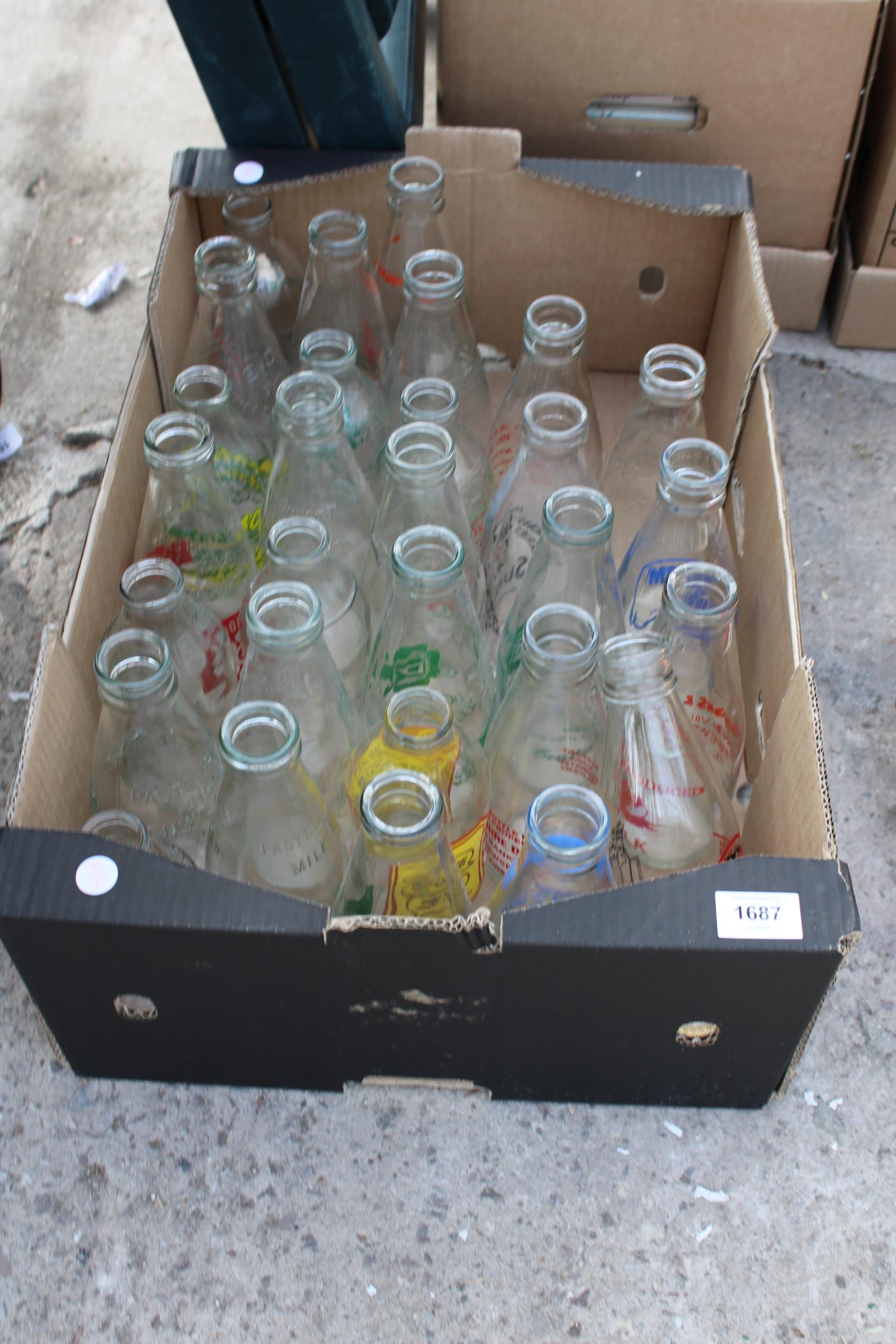 AN ASSORTMENT OF VINTAGE BRANDED ADVERTISING MILK BOTTLES