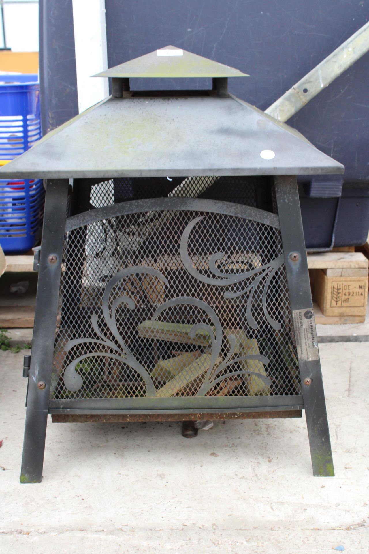 A METAL GARDEN FIRE PIT