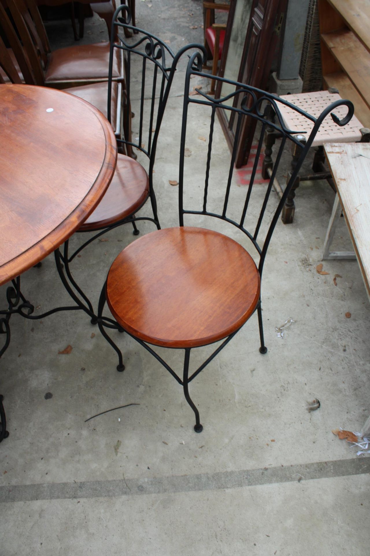 A HARDWOOD DINING TABLE ON A METALWARE BASE 36" DIAMETER AND FOUR MATCHING CHAIRS - Image 3 of 4