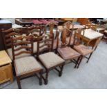 A SET OF FOUR MAHOGANY FIDDLE BACK DINING CHAIRS ON TAPERING LEGS WITH SPADE FEET