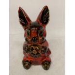 AN ANITA HARRIS HAND PAINTED AND SIGNED IN GOLD RABBIT MONEY BOX