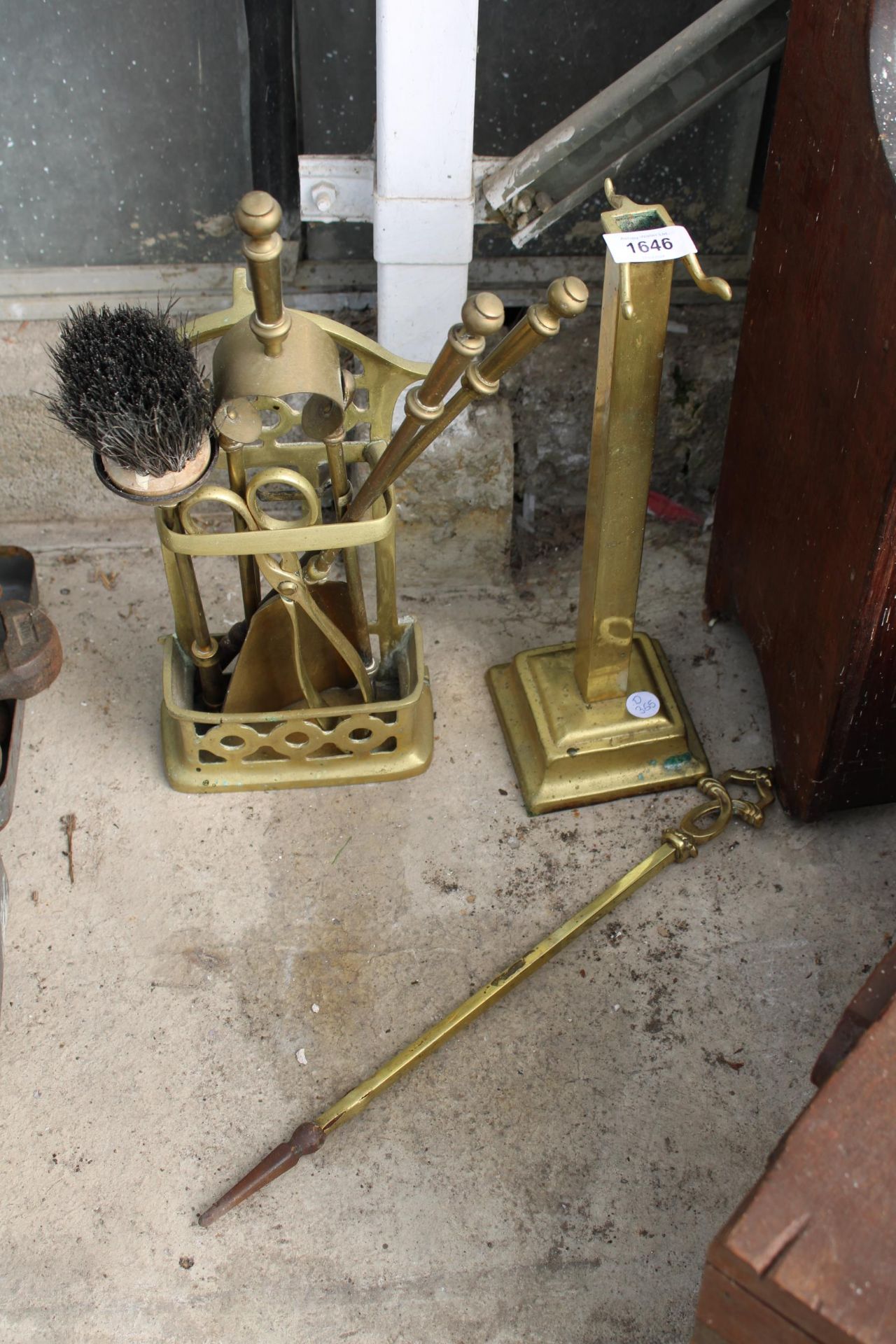 A VINTAGE BRASS COMPANION SET AND A FURTHER BRASS STAND