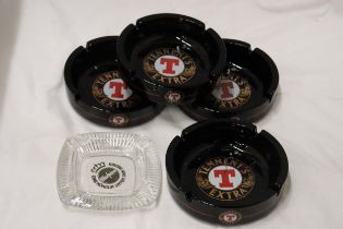 FIVE GLASS PUN ASHTRAYS TO INCLUDE TENNENTS EXTRA