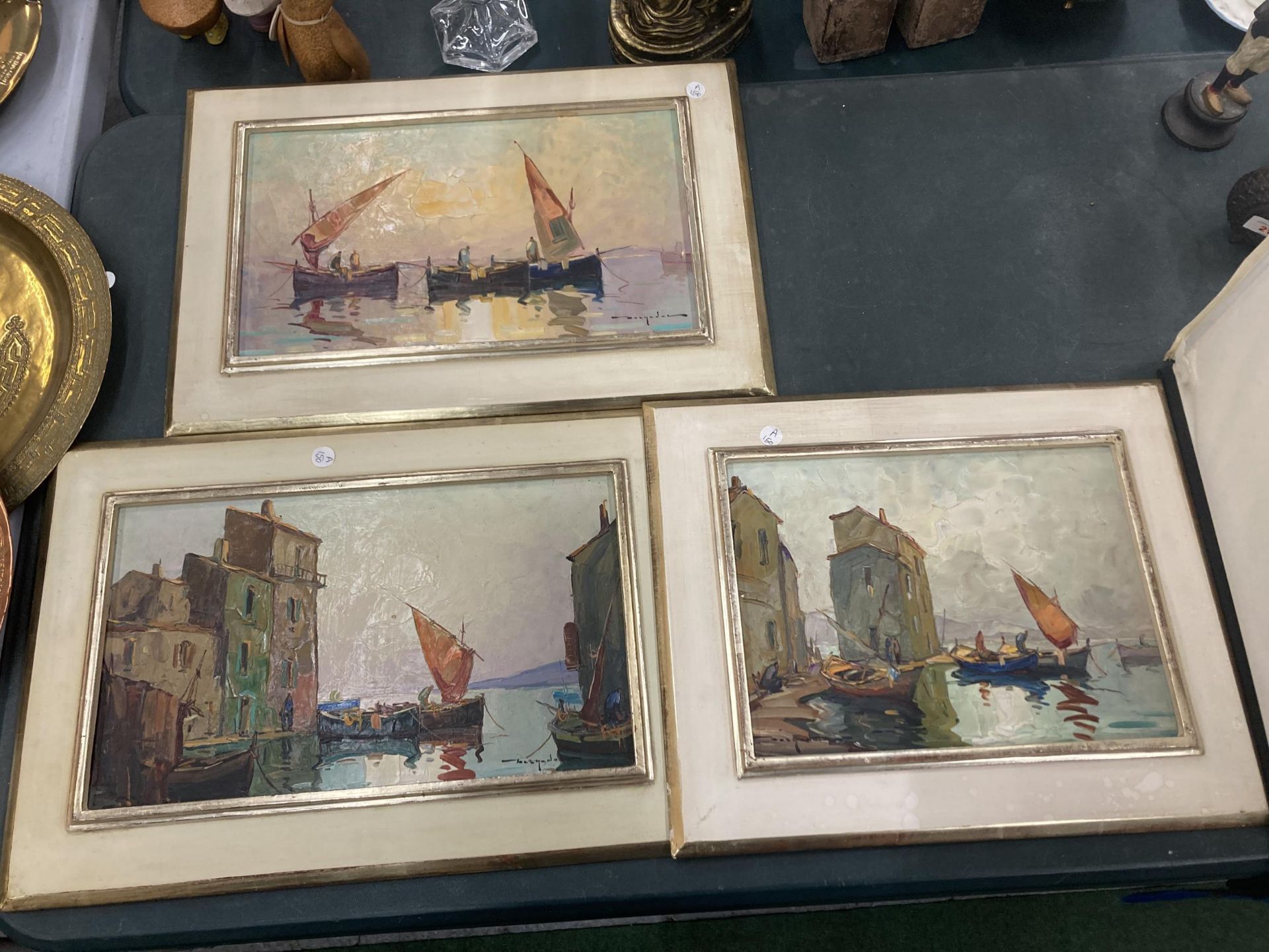 THREE FRAMED OIL ON BOARD PAINTINGS OF BOATS SIGNED