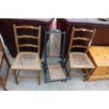 A PAIR OF EDWARDIAN BEDROOM CHAIRS AND EBONISED CAMPAIGN STYLE FOLDING CHAIR WITH CANE BACK AND SEAT